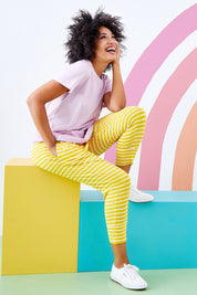 Model Olivia wearing size 10 of the Fundamental Brunch Pant Stripe in colour Mustard, from the front, showing the whole outfit