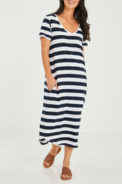 Model Katie wearing size 10 of the Fundamental Maeve Midi Dress in colour Navystrip (Blue), from the front, cropped image