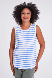 Model Olivia wearing size 10 of the Fundamental Scoop Tank in colour Cornflwhit (Blue), from the front, cropped image