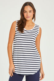 Model Elhana wearing size 10 of the Fundamental Scoop Tank in colour Navywhit (Blue), from the front, cropped image