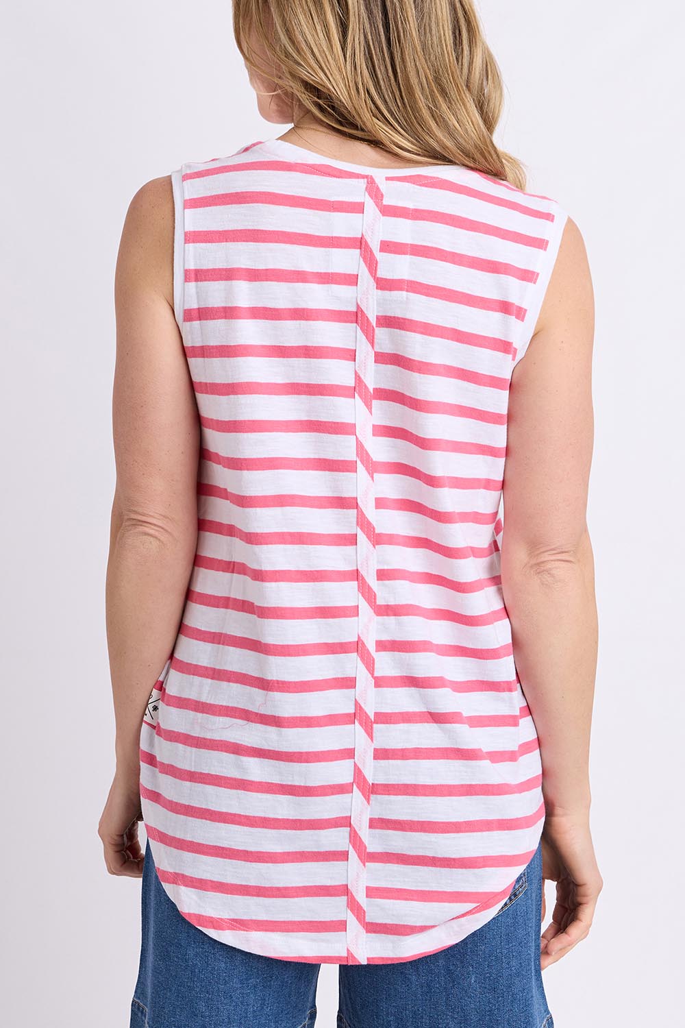 Model Genericm wearing size sample of the " Fundamental Scoop Tank" – Whitepink in colour Whitepink, from the back