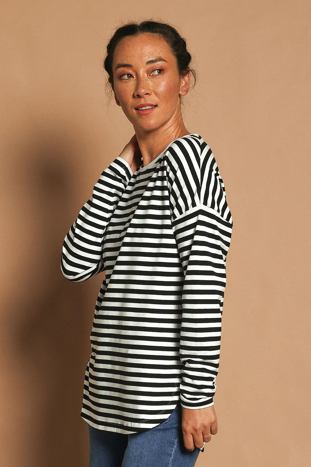Model Katie wearing size 10 of the Fundamental Lauren Stripe LS Tee in colour Blkwhte (Black), from the front, showing the whole outfit