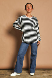 Model Katie wearing size 10 of the Fundamental Lauren Stripe LS Tee in colour Blkwhte (Black), from the front, showing the whole outfit