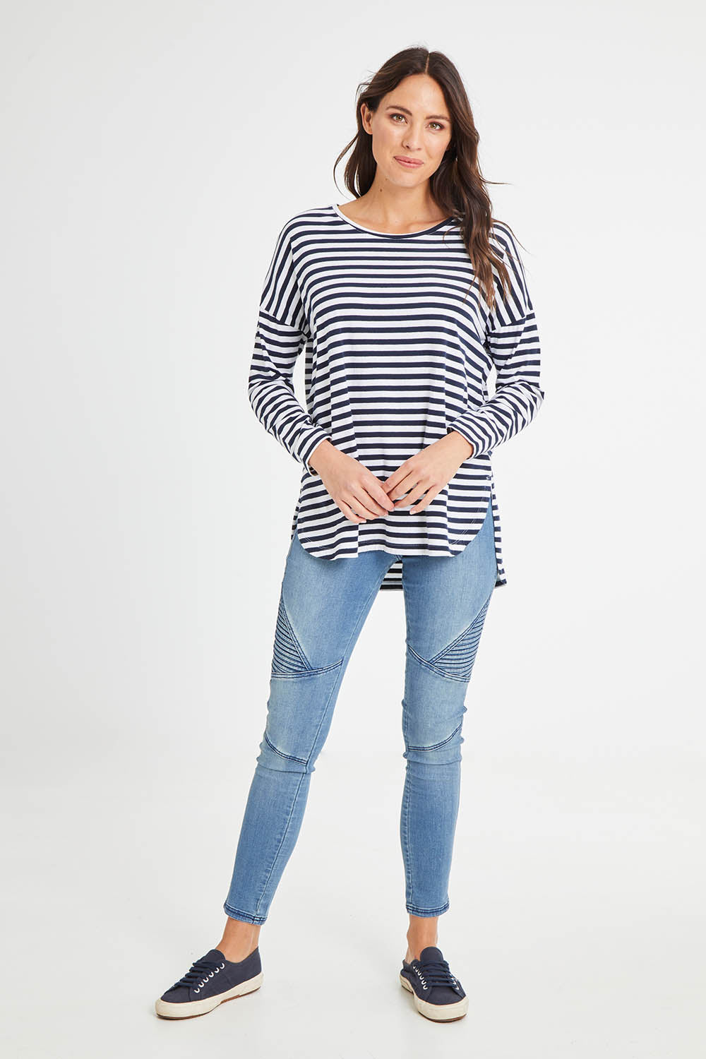 Model Madeline wearing size 10 of the Fundamental Lauren Stripe LS Tee in colour Navywht (Blue), from the front, showing the whole outfit