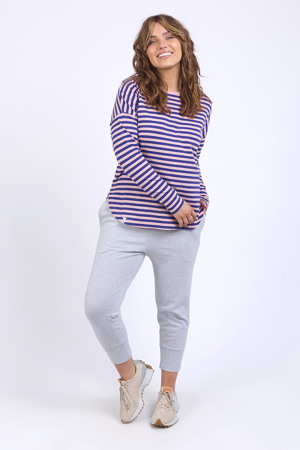 A model wearing the Fundamental Lauren Stripe LS Tee in colour Pinknavy (Pink), from the front, showing the whole outfit