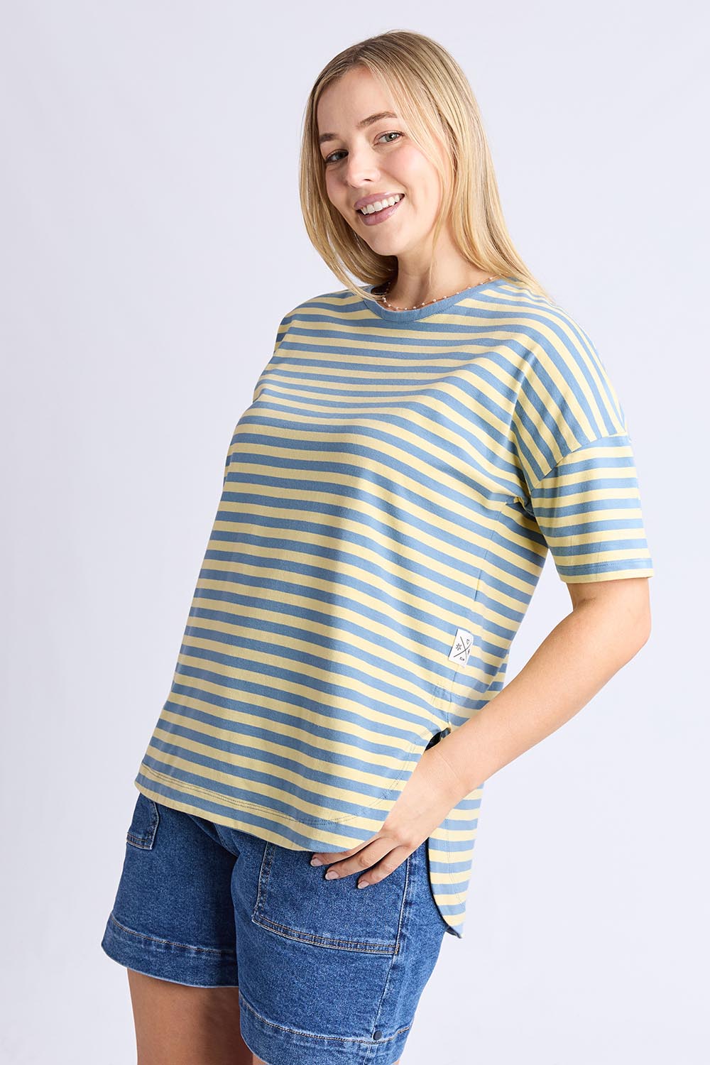 A model wearing the Fundamental Lauren S/S Cotton Stripe in colour Bluebanana (Blue), from the front, cropped image