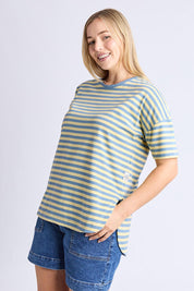 A model wearing the Fundamental Lauren S/S Cotton Stripe in colour Bluebanana (Blue), from the front, cropped image