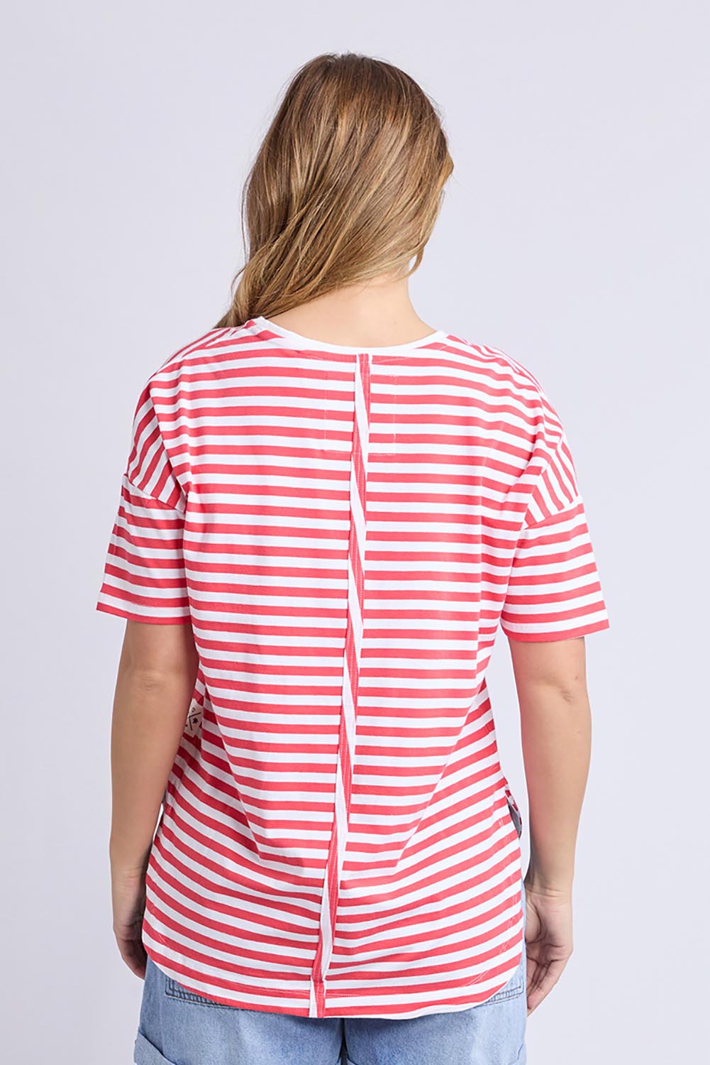 A model wearing the Fundamental Lauren S/S Cotton Stripe in colour Cayannewht (Red), from the back