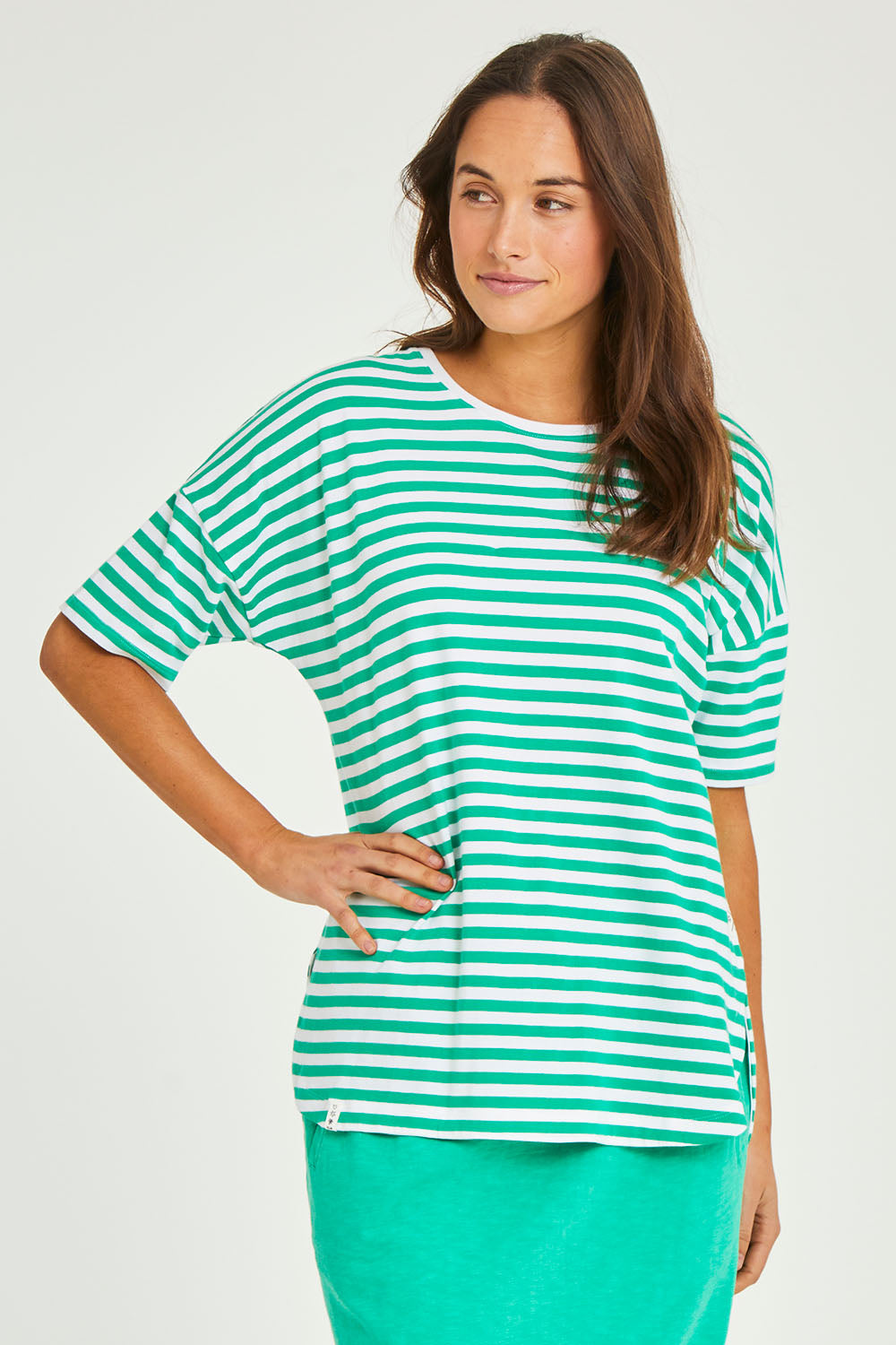 Model Elhana wearing size 10 of the Fundamental Lauren S/S Cotton Stripe in colour Greenwhit (Green), from the front, cropped image