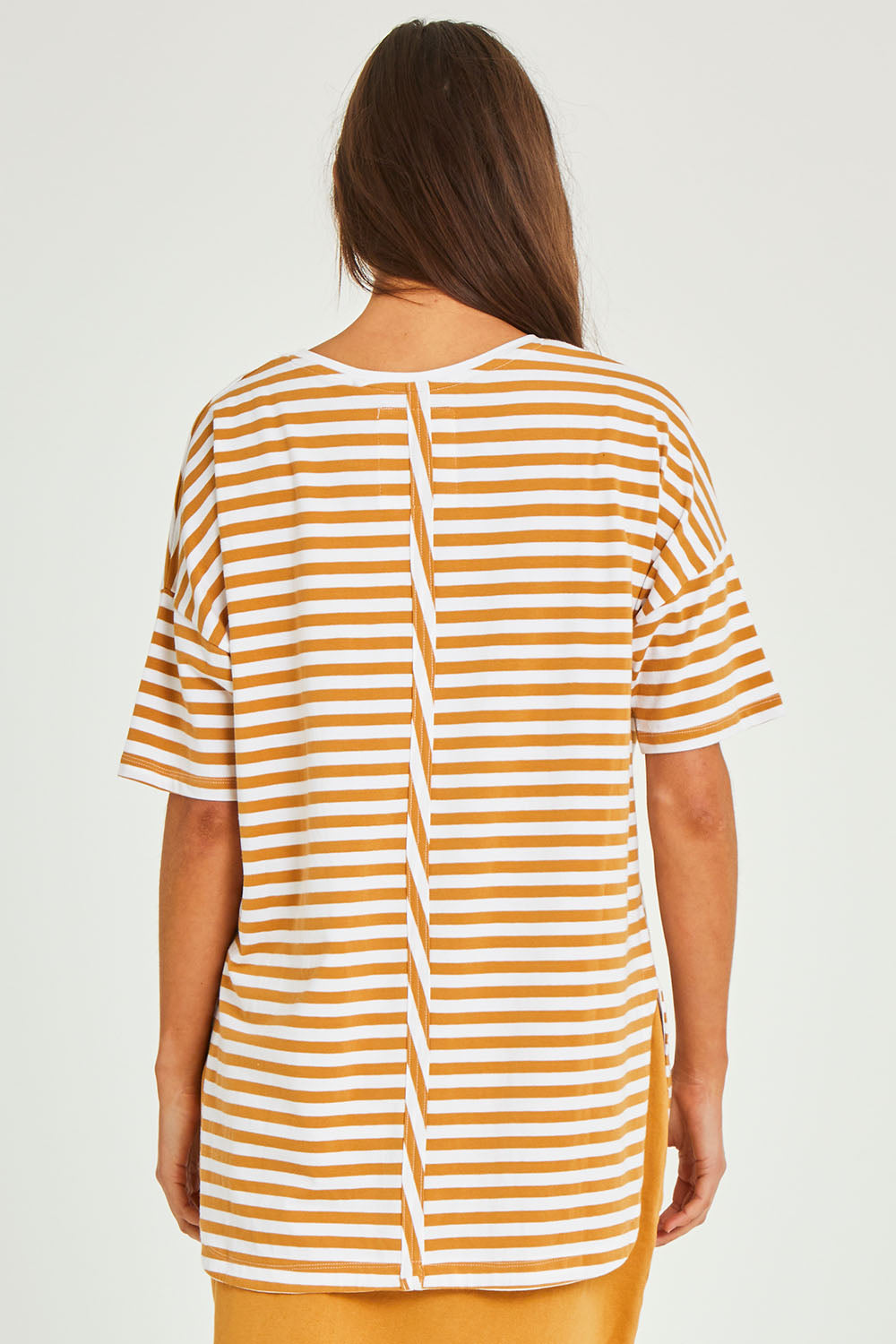 Model Elhana wearing size 10 of the Fundamental Lauren S/S Cotton Stripe in colour Honeywhit, from the back