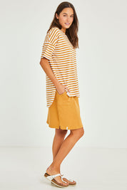 Model Elhana wearing size 10 of the Fundamental Lauren S/S Cotton Stripe in colour Honeywhit, from the front, showing the whole outfit