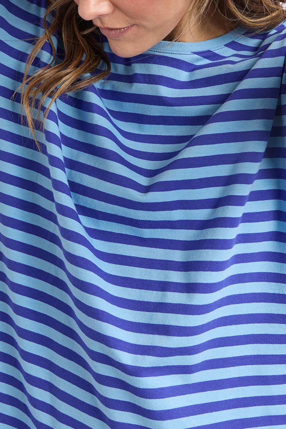 A model wearing the Fundamental Lauren S/S Cotton Stripe in colour Oceanblue (Blue), from the front, cropped image