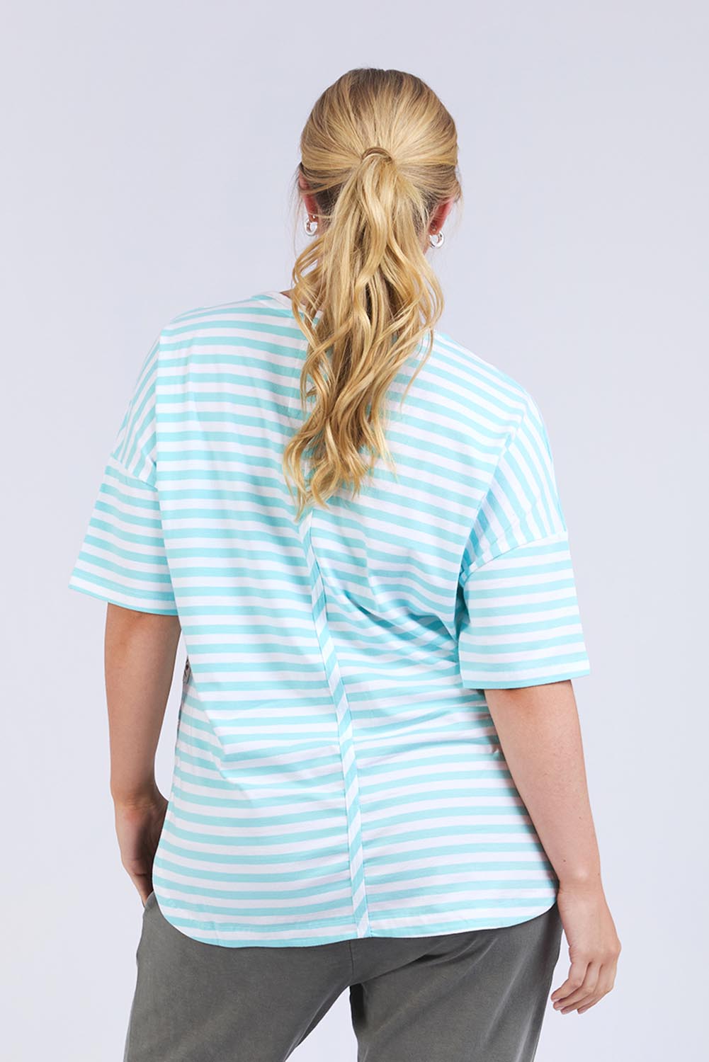 Model Genericm wearing size sample of the Fundamental Lauren S/S Cotton Stripe - Tonicblue in colour Tonicblue, from the back