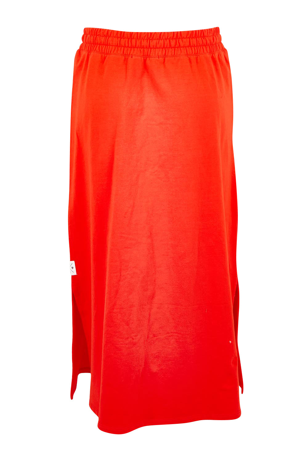 Product shot of the Fundamental Travel Skirt – Tangello in colour Tangello, from the back