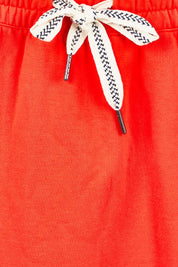 Product shot of the Fundamental Travel Skirt – Tangello in colour Tangello, showing detail
