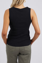 A model wearing the Fundamental Rib Crew Cotton Tank in colour Black (Black), from the back