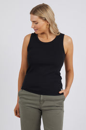A model wearing the Fundamental Rib Crew Cotton Tank in colour Black (Black), from the front, cropped image