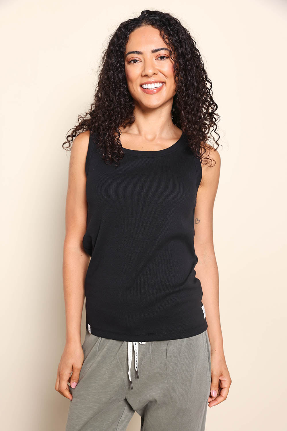 Model Pamelar wearing size 10 of the Fundamental Rib Crew Cotton Tank - Black in colour Black, in a cropped view