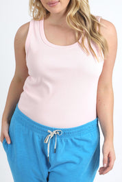 A model wearing the Fundamental Rib Crew Cotton Tank in colour Pnkaboo (Pink), from the front, cropped image