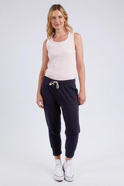 A model wearing the Fundamental Rib Crew Cotton Tank in colour Pnkaboo (Pink), from the front, showing the whole outfit