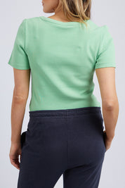 A model wearing the Fundamental Rib Scoop S/S  Tee in colour Meadow (Green), from the back