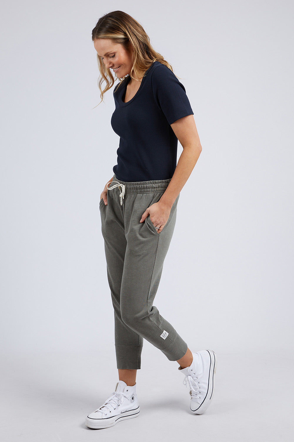 A model wearing the Fundamental Rib Scoop S/S  Tee in colour Navy (Blue), from the front, showing the whole outfit