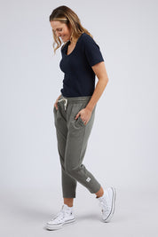 A model wearing the Fundamental Rib Scoop S/S  Tee in colour Navy (Blue), from the front, showing the whole outfit