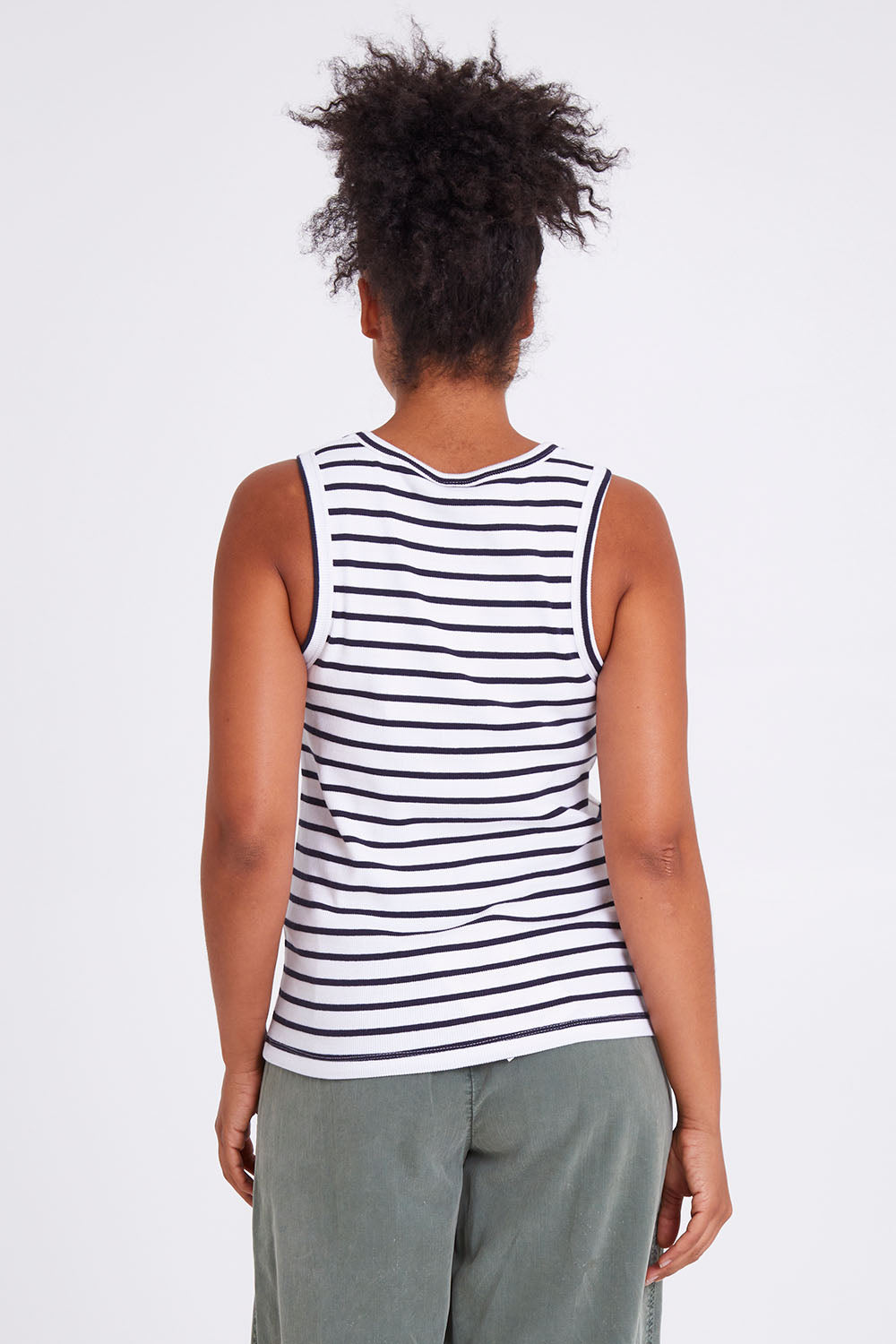 Model Olivia wearing size 10 of the Fundamental Indra Stripe Tank in colour Whitenavy (White), from the back