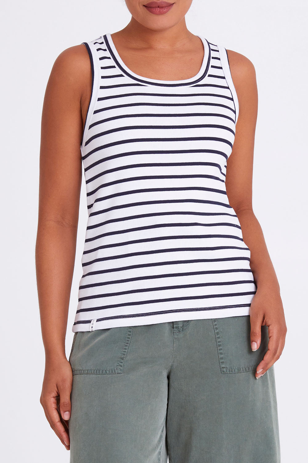 Model Olivia wearing size 10 of the Fundamental Indra Stripe Tank in colour Whitenavy (White), from the front, cropped image