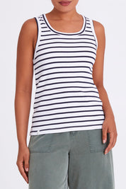 Model Olivia wearing size 10 of the Fundamental Indra Stripe Tank in colour Whitenavy (White), from the front, cropped image