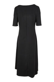 Product shot of the Fundamental Marguerite Dress in colour Black (Black), from the back
