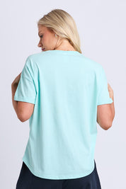 Model Genericm wearing size sample of the Fundamental Halli Cotton Tee – Tonicblue in colour Tonicblue, from the back