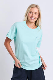 Model Genericm wearing size sample of the Fundamental Halli Cotton Tee – Tonicblue in colour Tonicblue, in a cropped view