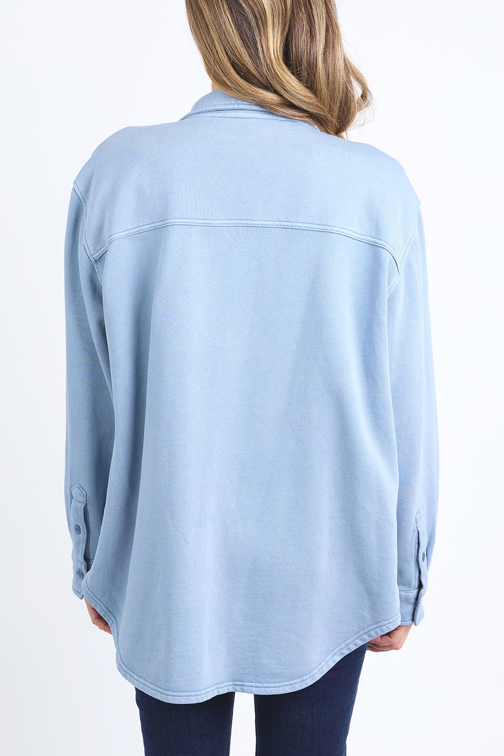 A model wearing the Fundamental Poppy Cotton Fleece Shacket in colour Steelblue (Blue), from the back