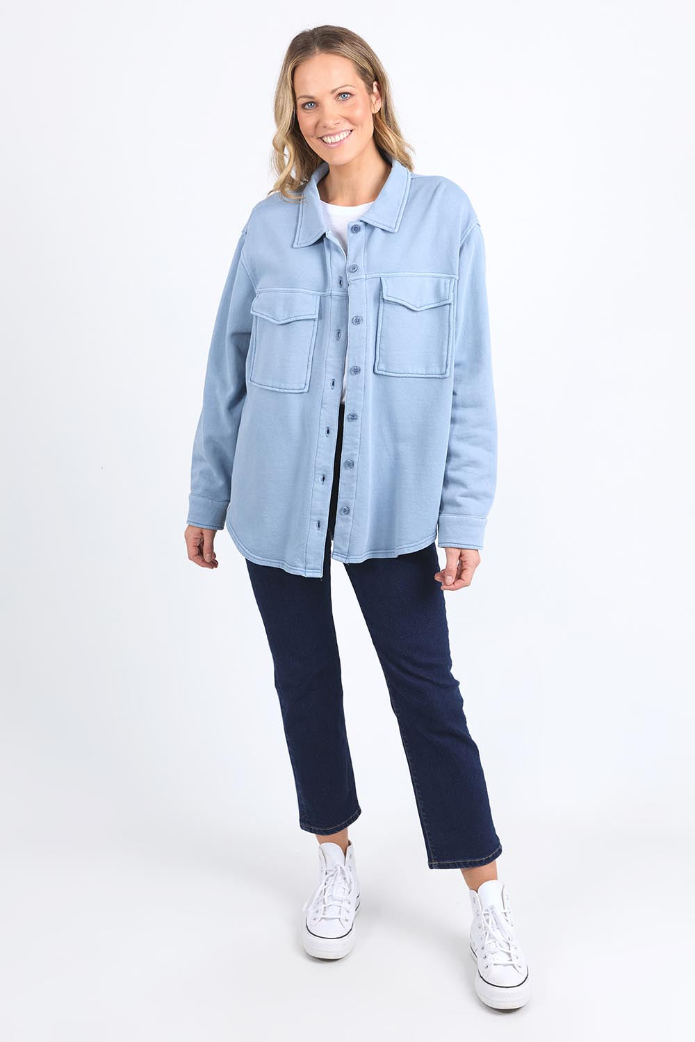 A model wearing the Fundamental Poppy Cotton Fleece Shacket in colour Steelblue (Blue), from the front, showing the whole outfit