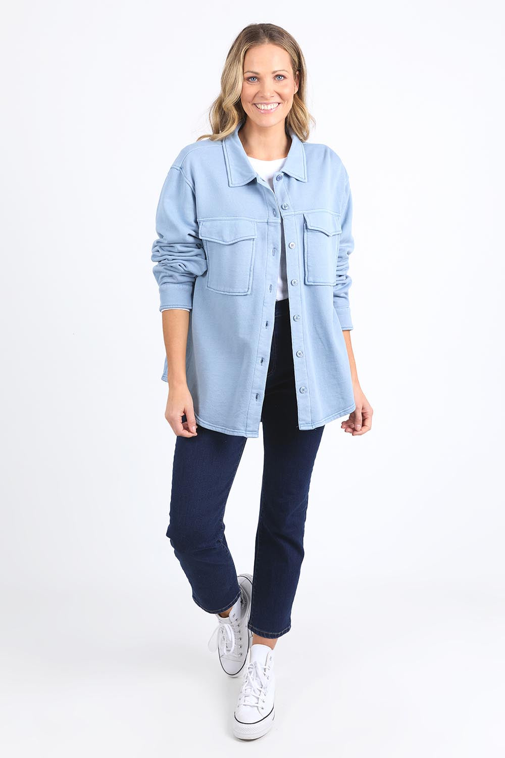 A model wearing the Fundamental Poppy Cotton Fleece Shacket in colour Steelblue (Blue), from the front, showing the whole outfit