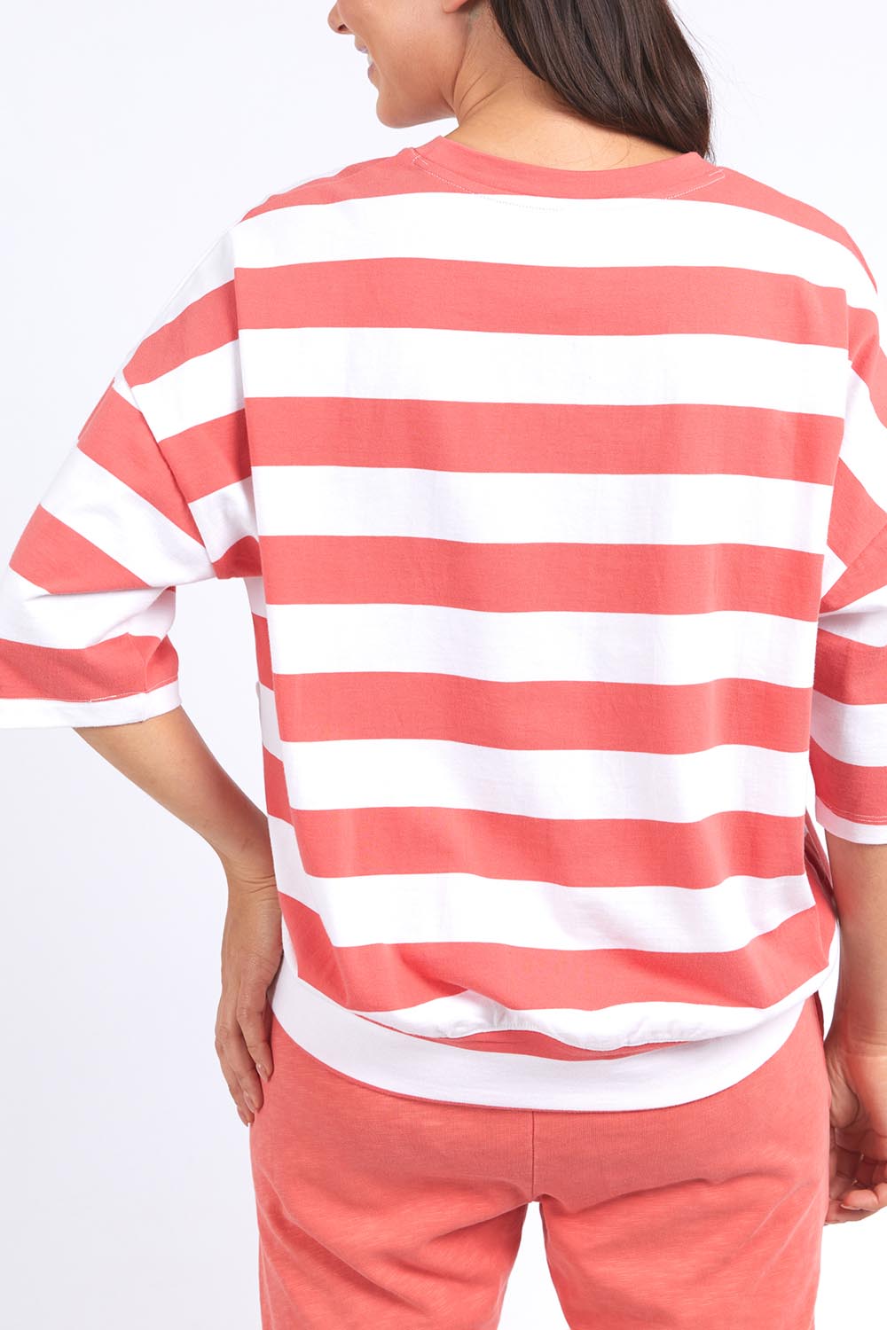 A model wearing the Fundamental Mazie Block Stripe Cotton Sweat in colour Watermelon (Red), from the back