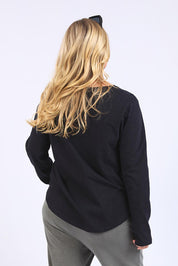 A model wearing the Fundamental Everyday Cotton Long Sleeve Tee in colour Black (Black), from the back