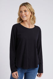 A model wearing the Fundamental Everyday Cotton Long Sleeve Tee in colour Black (Black), from the front, cropped image