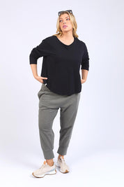 A model wearing the Fundamental Everyday Cotton Long Sleeve Tee in colour Black (Black), from the front, showing the whole outfit