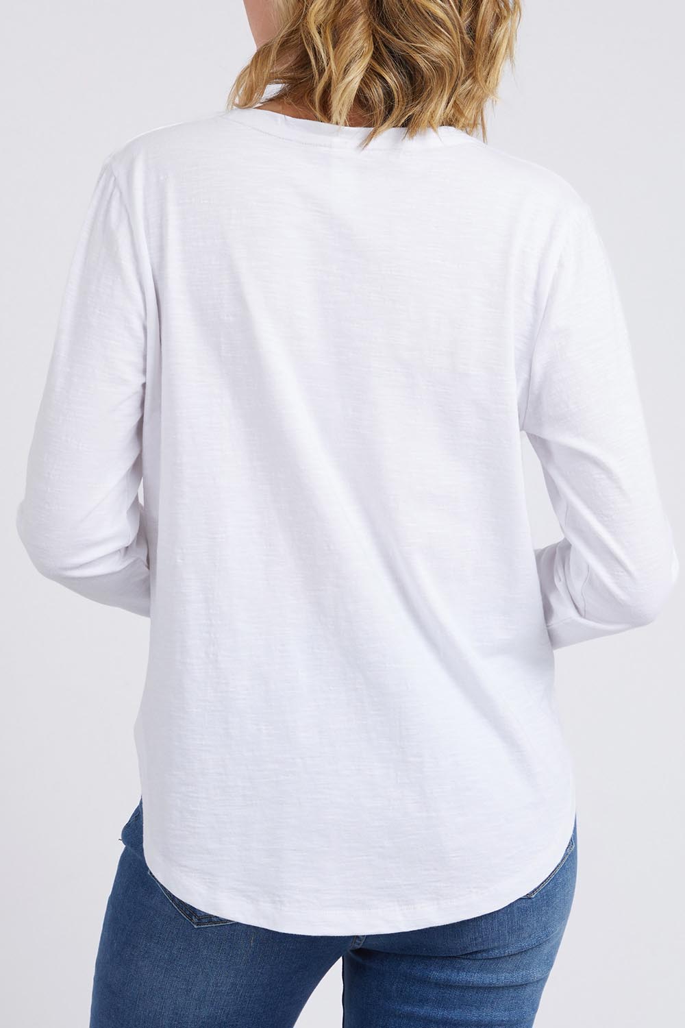 A model wearing the Fundamental Everyday Cotton Long Sleeve Tee in colour White (White), from the back