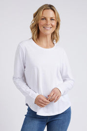 A model wearing the Fundamental Everyday Cotton Long Sleeve Tee in colour White (White), from the front, cropped image