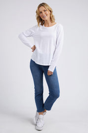 A model wearing the Fundamental Everyday Cotton Long Sleeve Tee in colour White (White), from the front, showing the whole outfit