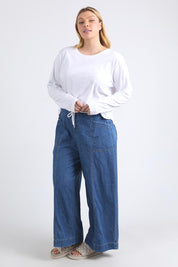 A model wearing the Fundamental Everyday Cotton Long Sleeve Tee in colour White (White), from the front, showing the whole outfit