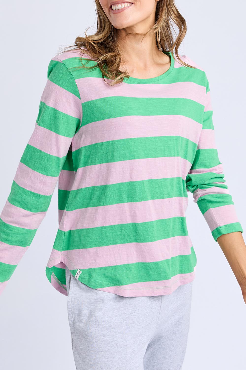 A model wearing the Fundamental Spritz Stripe Cotton Tee in colour Greenpink (Green), from the front, cropped image