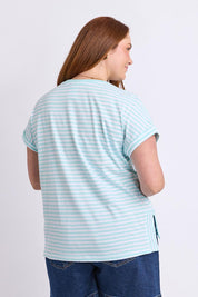 Model Genericm wearing size sample of the Fundamental Yara Stripe Ss Cotton Tee – Tonicblue in colour Tonicblue, from an angle