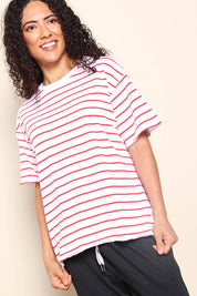 Model Pamelar wearing size 10 of the Fundamental Winona Stripe Cotton Tee - Redwhite in colour Redwhite, from an angle