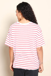 Model Pamelar wearing size 10 of the Fundamental Winona Stripe Cotton Tee - Redwhite in colour Redwhite, from the back