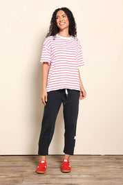 Model Pamelar wearing size 10 of the Fundamental Winona Stripe Cotton Tee - Redwhite in colour Redwhite, from the front