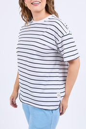 A model wearing the Fundamental Winona Stripe Cotton Tee in colour Whitenavy (White), from the front, cropped image